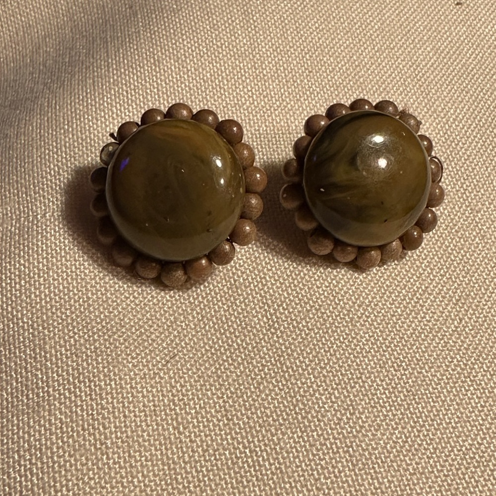 Vintage clasp back brownish green earrings.